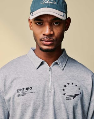 ASOS DESIGN boxy oversized zipped polo with sports graphic in grey marl rib