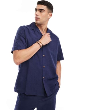 ASOS DESIGN co-ord 90s oversized short sleeve shirt in seersucker texture in navy