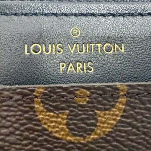 Louis Vuitton Monogram Canvas Slim Purse in Brown Leather