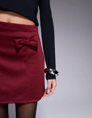 ASOS DESIGN a-line mini skirt with bow details in burgundy