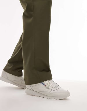 Reebok Classic leather trainers in white and blue