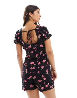 ASOS DESIGN snurrad spetskantad korsett midja jumpsuit i svart blommönster