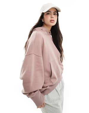 ASOS DESIGN oversized hoodie med hög-låg fåll i tvättad dämpad rosa