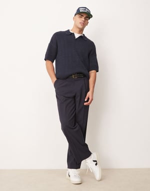 ASOS DESIGN avslappnad passform ribbad stickad polo i marinblå