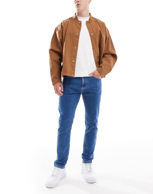 Tommy Jeans Austin slim tapered jeans i mellan tvätt