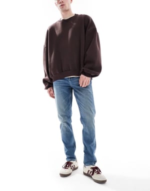 ASOS DESIGN skinnyjeans med grön ton i mörkblå tvätt