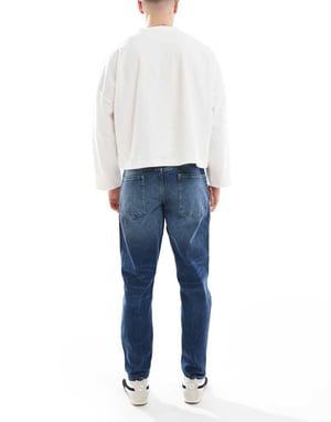 ASOS DESIGN tapered jeans in dark wash