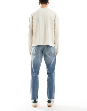 ASOS DESIGN stretch tapered jeans in mid wash blue