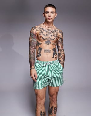 ASOS DESIGN seersucker stripe swim shorts in short length in green