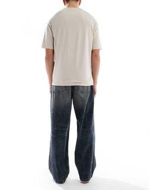 ASOS DESIGN loose jeans in mid wash blue