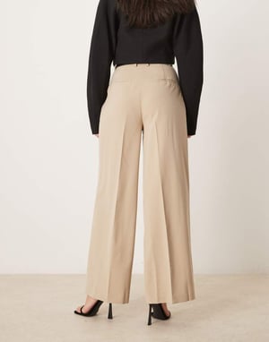 ASOS DESIGN tailored relaxed trousers with faux leather belt in stone