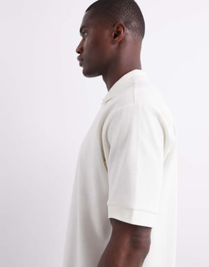 ARKET texturerad jersey kortärmad polo i vitt