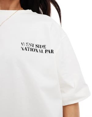 ASOS DESIGN oversized t-shirt med liljekonvalj grafisk i off white