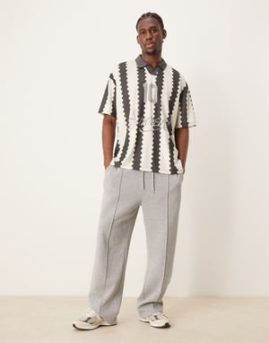 ASOS DESIGN oversized polo med fotbollsgraphic och heltryck