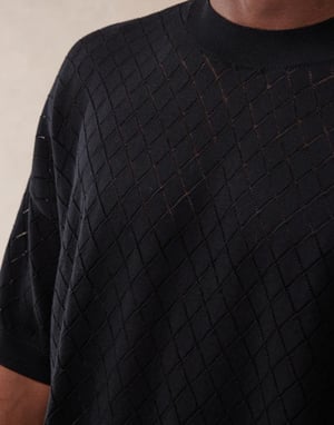 ASOS DESIGN oversize passform punktstickad t-shirt med argylemönster i svart
