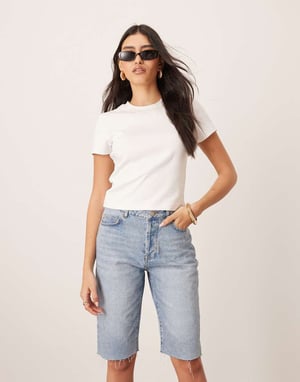 ARRANGE Cleo denim longline short with raw hem in mid wash blue