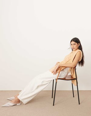 ARRANGE cable knit sleeveless jumper with tie detail in apricot