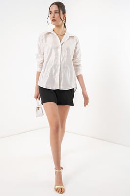 Oversized gestreepte blouse met knopen