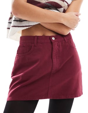 ASOS DESIGN denim mini skirt in burgundy