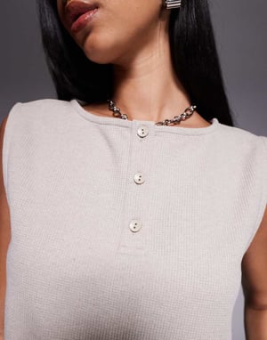 ASOS DESIGN sleeveless waffle button through top in mini frill hem in cream