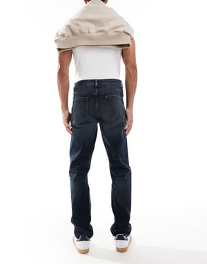 ASOS DESIGN slim jeans med toning i mörk tvättblå