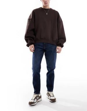 ASOS DESIGN stretch tapered jeans i mörk tvätt