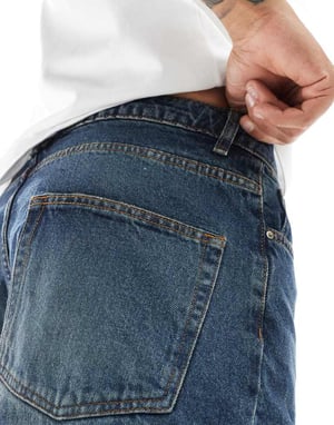 ASOS DESIGN tapered jeans i mörk tvättad blå