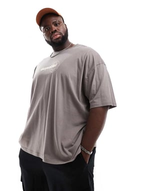 ASOS DESIGN oversized t-shirt i brunt med abstrakta flerfärgade tryck