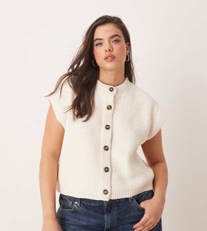 ASOS DESIGN Curve boxy knitted stitch waistcoat with button detail in cream