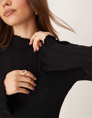 Gina Tricot long sleeve ribbed knit top with fluted funnel neck and cuffs in black