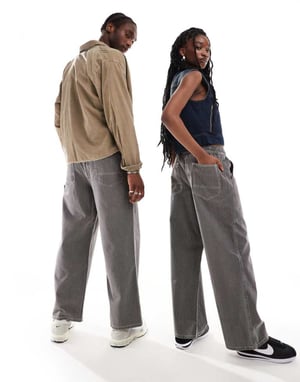 COLLUSION Unisex dragsbyxor i denim med fickor i svart randig mönster