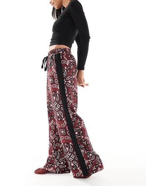 ASOS DESIGN pull on trousers with contrast panel in dark cherry bandana print