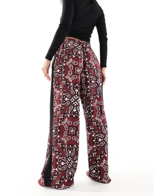 ASOS DESIGN pull on trousers with contrast panel in dark cherry bandana print