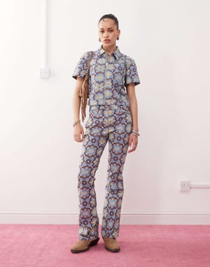 Wrangler co-ord bootcut 70s print jeans in blue
