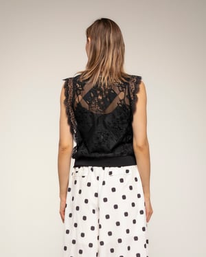 Semitransparante kantentop met elastische taille