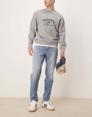 ASOS DESIGN tapered jeans in mid wash blue