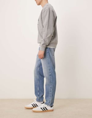 ASOS DESIGN tapered jeans in mid wash blue