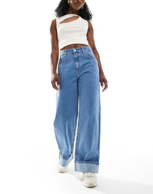 ASOS DESIGN loose jean with deep turn up cuff in clean mid blue
