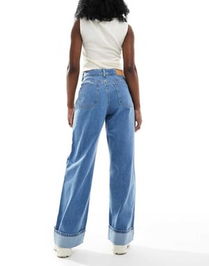 ASOS DESIGN loose jean with deep turn up cuff in clean mid blue