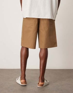 ASOS DESIGN long length pleated shorts in tan