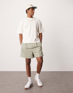 ASOS DESIGN smart bermuda shorts with front pleat and belt detail in green