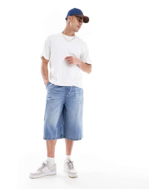 ASOS DESIGN longer length denim jort in mid wash blue with cargo pocket details