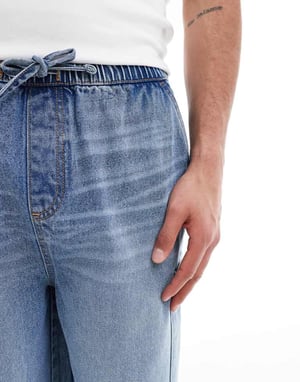ASOS DESIGN longer length denim jort in mid wash blue with cargo pocket details