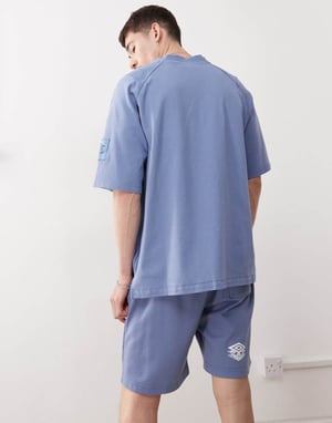 Umbro Drill embroidered logo shorts in blue