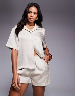 The Couture Club co-ord emblem satin shorts in beige