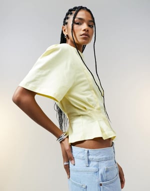 ASOS DESIGN seam detail short sleeve corset waist t-shirt in buttermilk