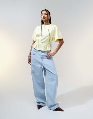 ASOS DESIGN seam detail short sleeve corset waist t-shirt in buttermilk
