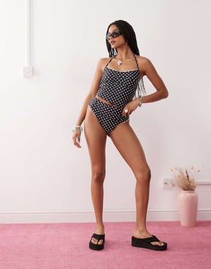 Reclaimed Vintage high waist bikini bottom with frilly trim in black polka dot print