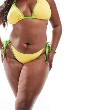 ASOS DESIGN Curve Dani tie side bikini bottom in yellow and green