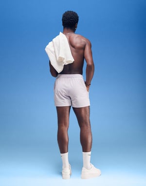 ASOS DESIGN seersucker swim shorts in short length in purple